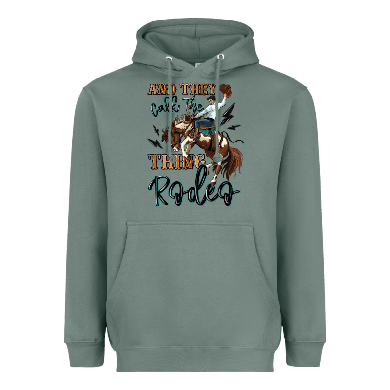 And They Call The Thing Rodeo Cowboy Heavyweight Hoodie by MaliasSmallBusiness | Teevron