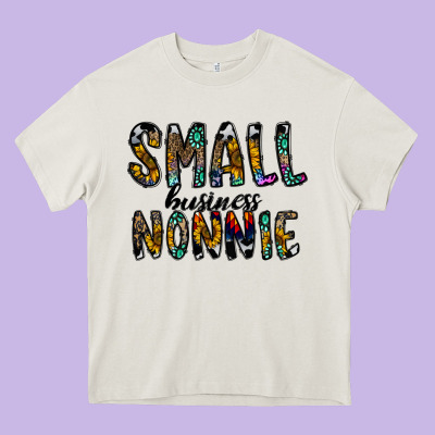 Small Business Nannie Heavy Core Tee Designed By Cowhidedigitalart