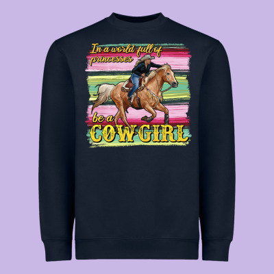 In A World Full Of Princesses Be A Cowgirl Heavyweight Sweatshirt Designed By Ranaportraitstore