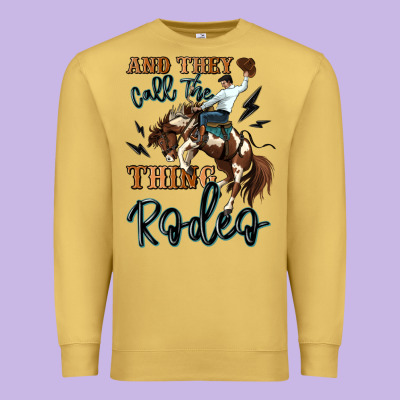 And They Call The Thing Rodeo Cowboy Premium Sweatshirt Designed By Maliassmallbusiness