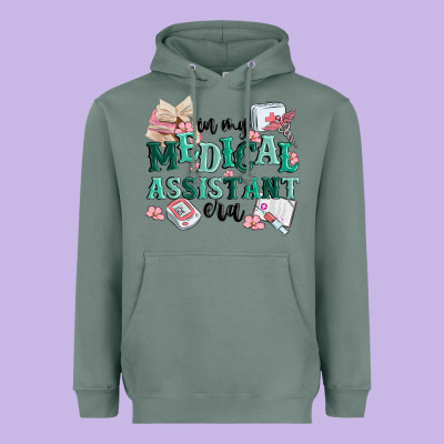 In My Medical Assistant Era Heavyweight Hoodie Designed By Maliassmallbusiness