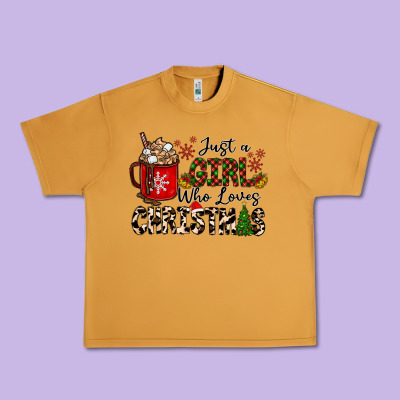 Just A Girl Who Loves Christmas Urban Heavy Tee Designed By Cowhidedigitalart