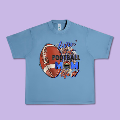 Livin' That Football Mom Life Urban Heavy Tee Designed By Zillion Design Studio