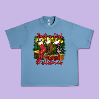 Just A Girl Who Loves Christmas Urban Heavy Tee Designed By Ranaportraitstore