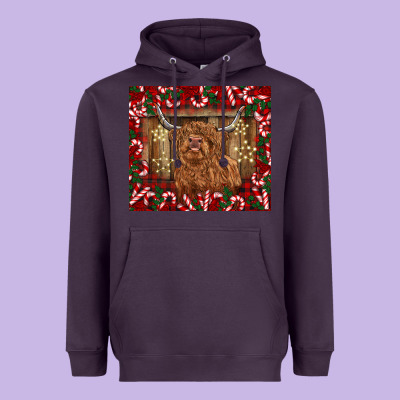 Christmas Highland Cow With Candy Canes Heavyweight Hoodie Designed By Barkaloodesign