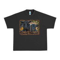 Pigment Black western black angus cattle and calf with leopard Urban Heavy Tee - RanaPortraitStore