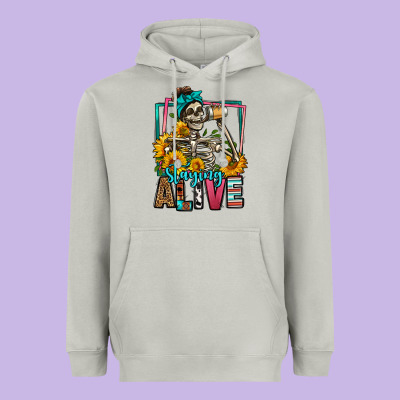 Staying Alive Coffee Drinking Skeleton Heavyweight Hoodie Designed By Jasminsmagicworld