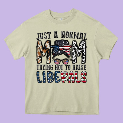 Just A Regular Mom Trying Not To Raise Liberals Heavy Core Tee Designed By Cowhidedigitalart