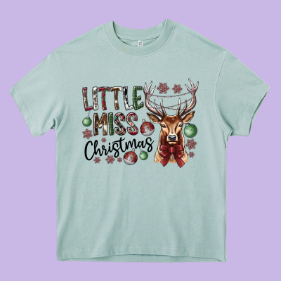 Little Miss Christmas Heavy Core Tee Designed By Cowhidedigitalart