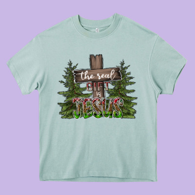 The Real Gift Is Jesus Heavy Core Tee Designed By Cowhidedigitalart