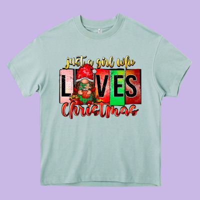 Just A Girl Who Loves Christmas Heavy Core Tee Designed By Cowhidedigitalart
