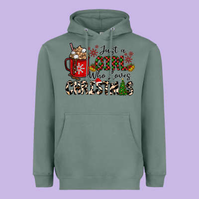 Just A Girl Who Loves Christmas Heavyweight Hoodie Designed By Cowhidedigitalart