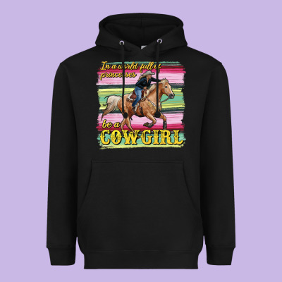 In A World Full Of Princesses Be A Cowgirl Heavyweight Hoodie Designed By Ranaportraitstore