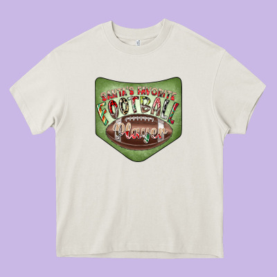Christmas Pocket Heavy Core Tee Designed By Cowhidedigitalart
