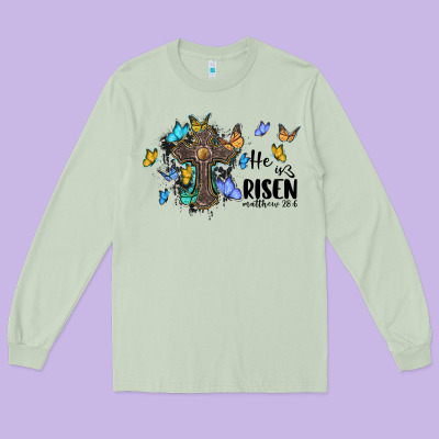 He Is Risen Matthew 28 6 Cross With Butterflies Cowhide Background Long Sleeve Tee Designed By Barkaloodesign