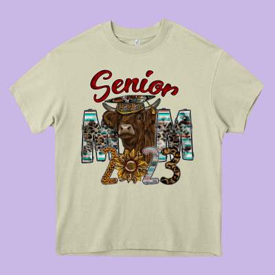 Senior Mom 2023 Heavy Core Tee Designed By Cowhidedigitalart