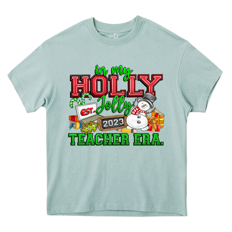 In My Holly Jolly Teacher Era Heavy Core Tee by CowhideDigitalArt | Teevron