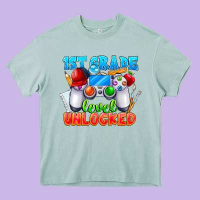 1st Grade Level Unlocked Heavy Core Tee Designed By Cowhidedigitalart