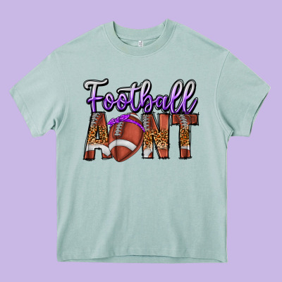 Football Aunt Heavy Core Tee Designed By Cowhidedigitalart