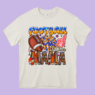 Football Mama Heavy Core Tee Designed By Cowhidedigitalart