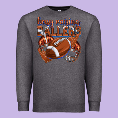 Premium Sweatshirt busy raising ballers football
