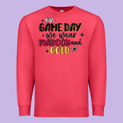 Premium Sweatshirt on game day we wear maroon and gold