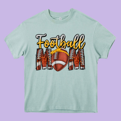 Football Mom Heavy Core Tee Designed By Cowhidedigitalart