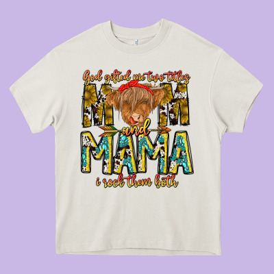 God Gifted Me Two Titles And Mama I Rock Them Both Heavy Core Tee Designed By Cowhidedigitalart