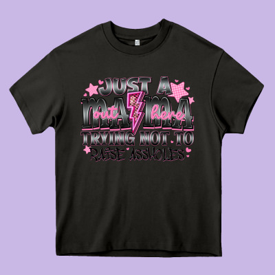 Just A Mama Out Here Trying Not To Raise Assholes Heavy Core Tee Designed By Cowhidedigitalart