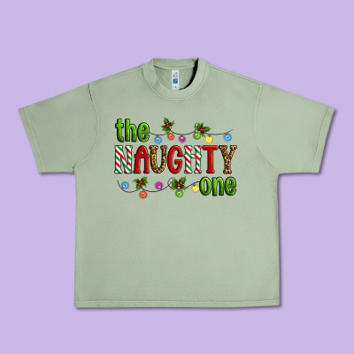 The Naughty One Christmas Urban Heavy Tee Designed By Artiststas