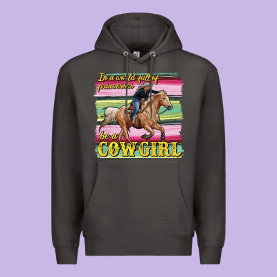 In A World Full Of Princesses Be A Cowgirl Premium Hoodie Designed By Ranaportraitstore