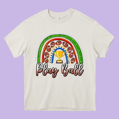 Play Ball Football Rainbow Heavy Core Tee Designed By Cowhidedigitalart