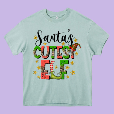 Santas Cutest Elf Heavy Core Tee Designed By Cowhidedigitalart