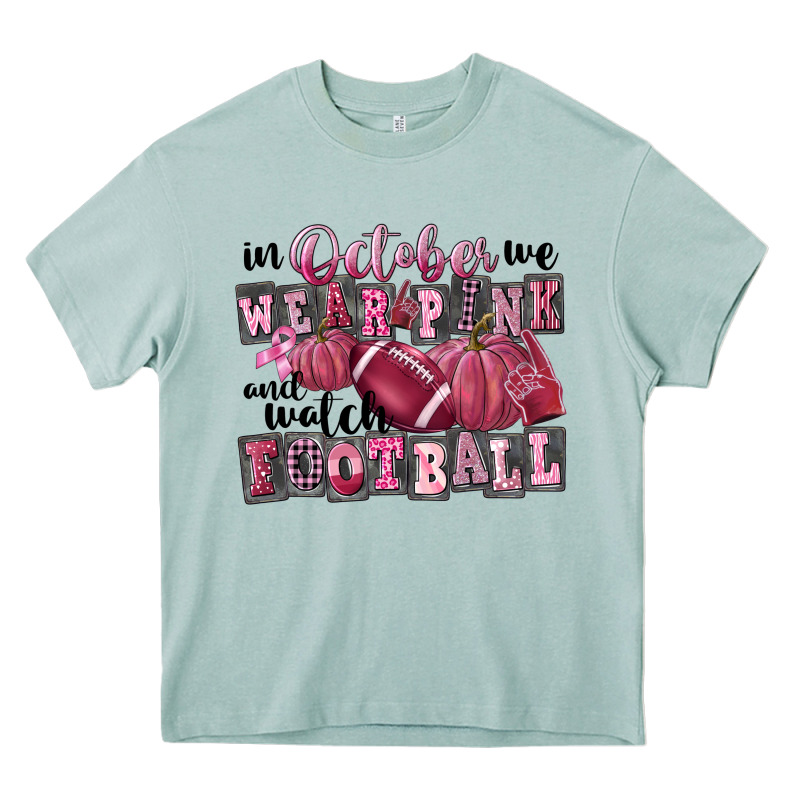 In October We Wear Pink And Watch Football Heavy Core Tee by FaDigitalArtStudio | Teevron