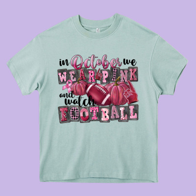 In October We Wear Pink And Watch Football Heavy Core Tee Designed By Fadigitalartstudio