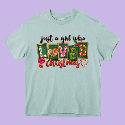 Just A Girl Who Loves Christmas Heavy Core Tee Designed By Fadigitalartstudio
