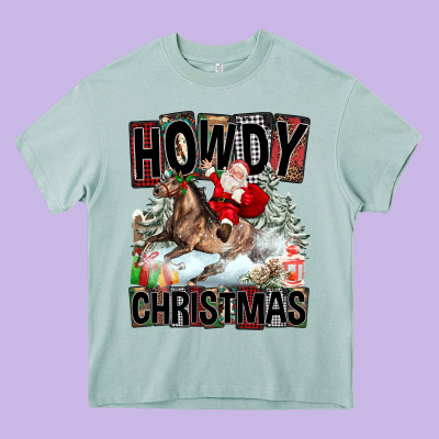 Howdy Christmas Rodeo Santa Heavy Core Tee Designed By Fadigitalartstudio