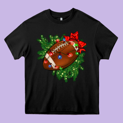 American Football Christmas With Lights And Ribbon Heavy Core Tee Designed By Fadigitalartstudio
