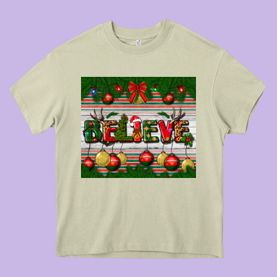 Christmas Believe Heavy Core Tee Designed By Bundleandbundleshop