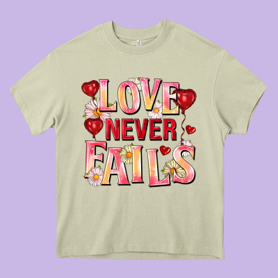 Love Never Fails Heavy Core Tee Designed By Fadigitalartstudio