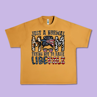 Just A Regular Mom Trying Not To Raise Liberals Urban Heavy Tee Designed By Cowhidedigitalart