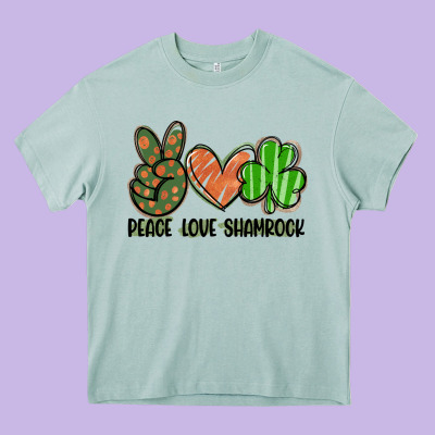 Peace Love Shamrock Heavy Core Tee Designed By Fadigitalartstudio