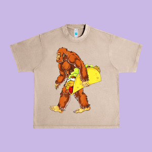 Bigfoot Carrying Taco Urban Heavy Tee Designed By Designefamous