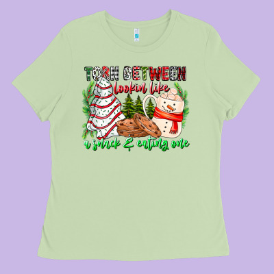 Torn Between Looking Like A Snack Eating One Ladies Tee Designed By Cowhidedigitalart