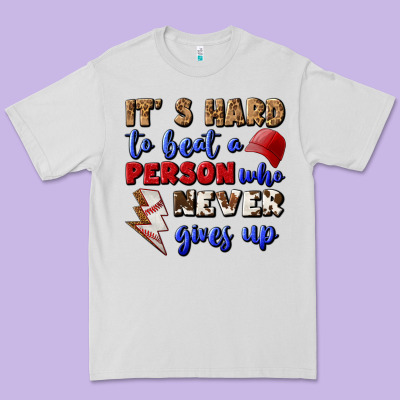 It's Hard To Beat A Person Who Never Gives Up Premium Tee Designed By Bundleandbundleshop