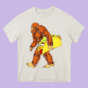 Bigfoot Carrying Taco Heavy Core Tee Designed By Artisfamous