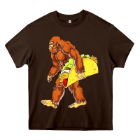 Chocolate Brown bigfoot carrying taco Heavy Core Tee - artisFamous