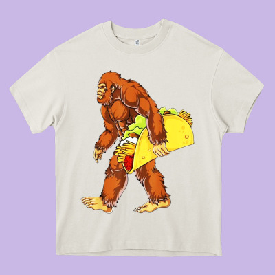 Bigfoot Carrying Taco Heavy Core Tee Designed By Artisfamous