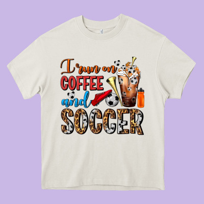 I Run On Coffee And Soccer Frappe Heavy Core Tee Designed By Fadigitalartstudio