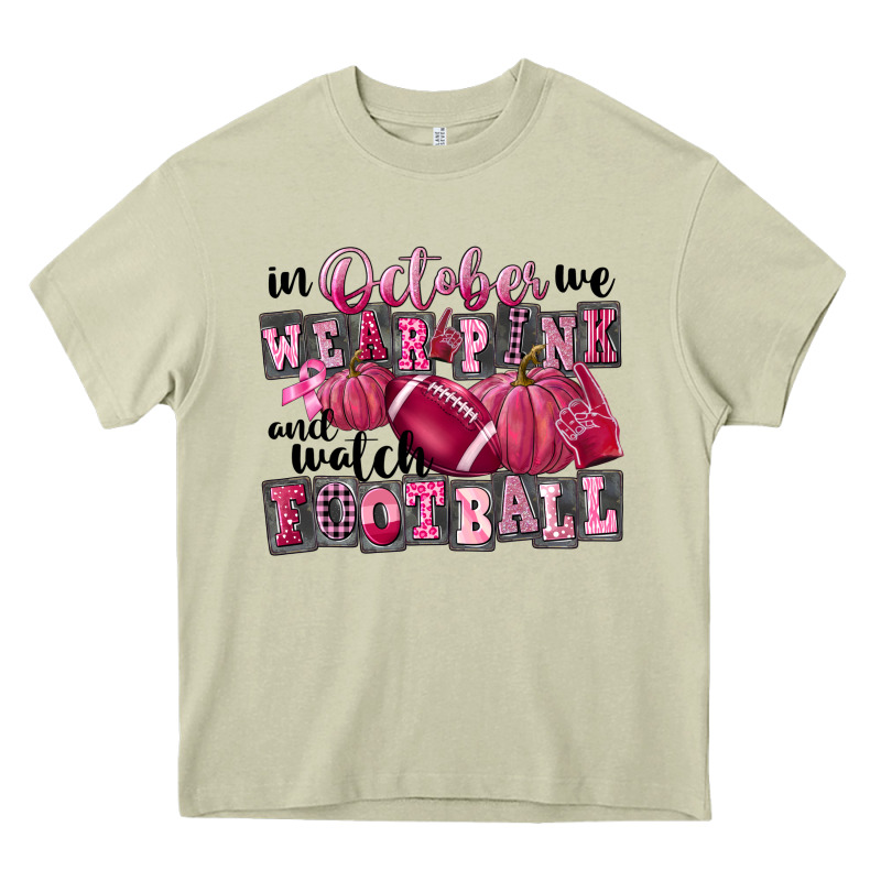 In October We Wear Pink And Watch Football Heavy Core Tee by FaDigitalArtStudio | Teevron